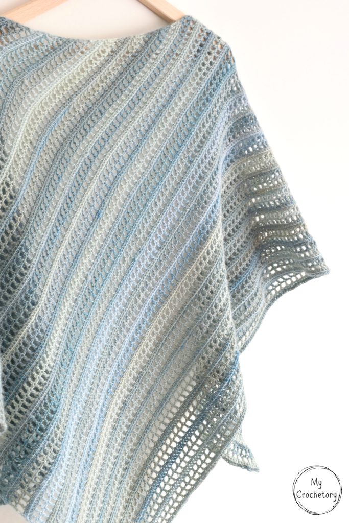 Aprilis Shawl - beginner friendly free crochet pattern by www.mycrochetory.com Aprilis Shawl - A beautiful asymmetrical simple crochet shawl pattern with a modern design, perfect for warmer weather.