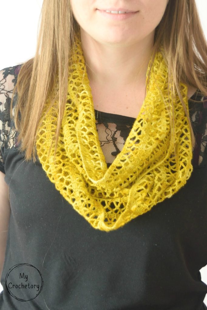 Step-by-step guide to crochet a stunning Sunny lace infinity scarf, featuring a captivating pattern that adds a stylish flair to your wardrobe.