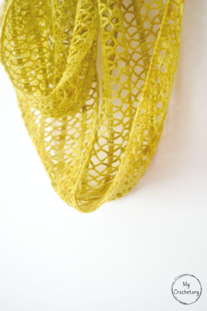 Step-by-step guide to crochet a stunning Sunny lace infinity scarf, featuring a captivating pattern that adds a stylish flair to your wardrobe.