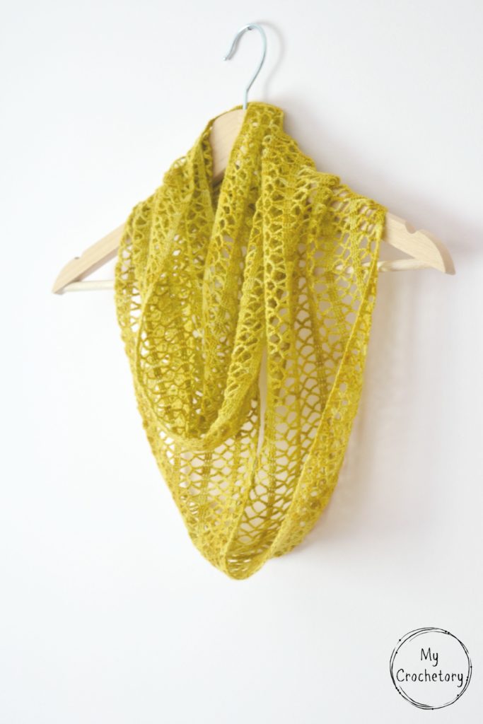Step-by-step guide to crochet a stunning Sunny lace infinity scarf, featuring a captivating pattern that adds a stylish flair to your wardrobe.