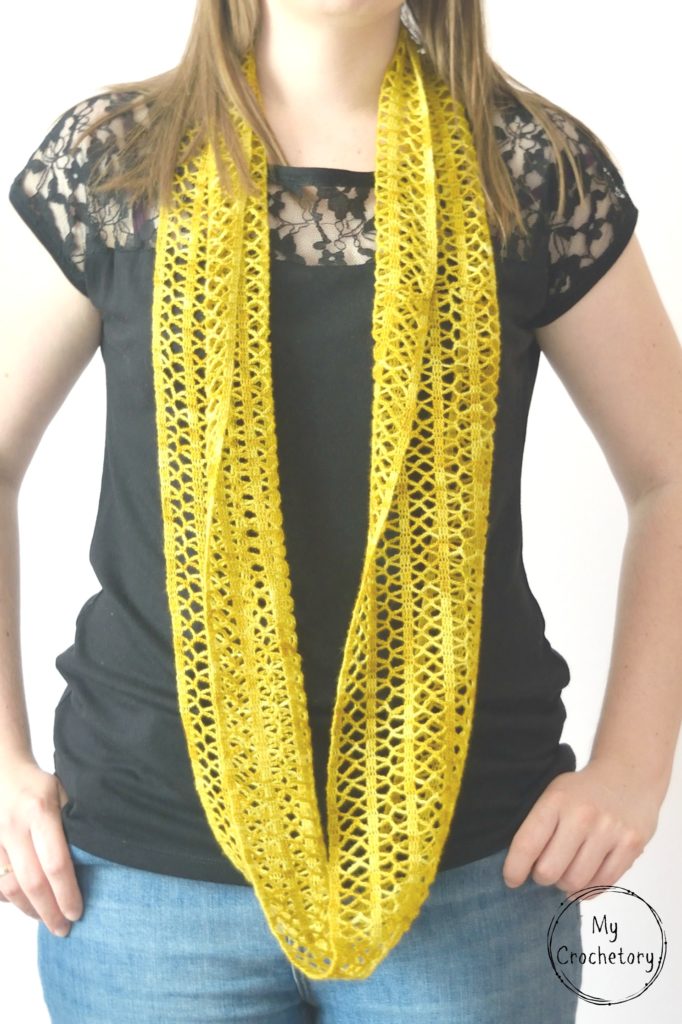 Step-by-step guide to crochet a stunning Sunny lace infinity scarf, featuring a captivating pattern that adds a stylish flair to your wardrobe.