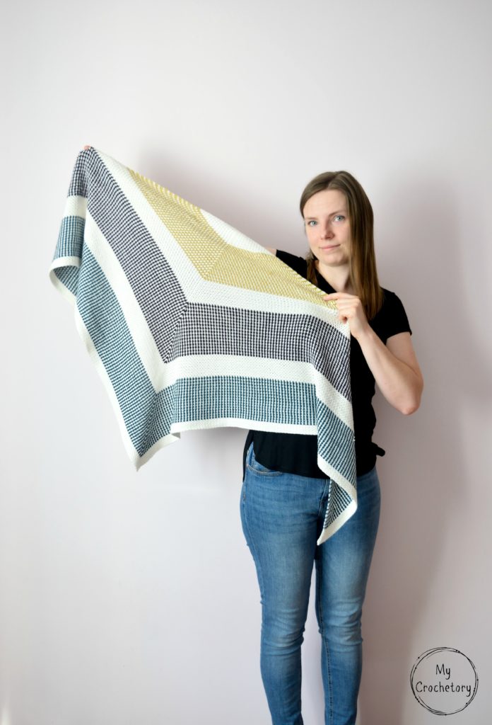 Free Triangle Crochet Shawl pattern showcasing the intricate moss stitch pattern.