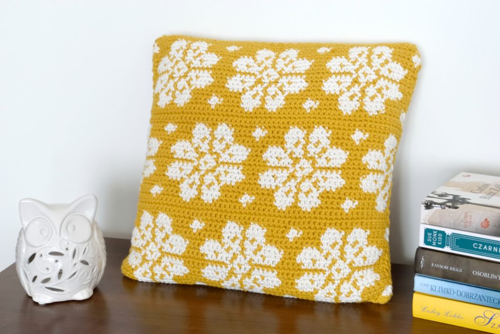 A vibrant and stylish crochet pillow cover showcasing a modern design. This free crochet pattern is perfect for adding a pop of style and charm to your home decor.