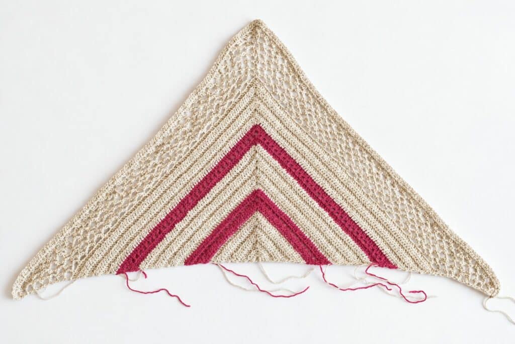 The starting triangle section of this trapezoid shawl crochet pattern, laid flat