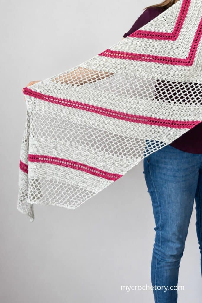 Another close-up of this trapezoid shawl crochet pattern worn around the shoulders