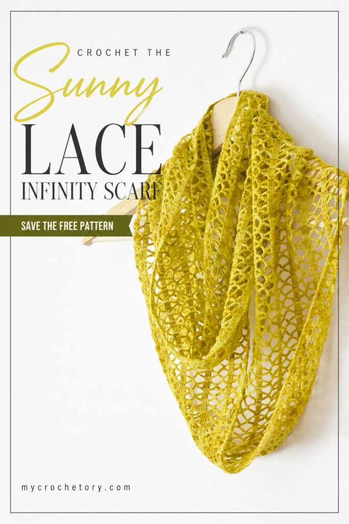 Crochet the Sunny Lace infinity scarf pin with an ochre crochet lace cowl on a wooden hanger, save the free pattern