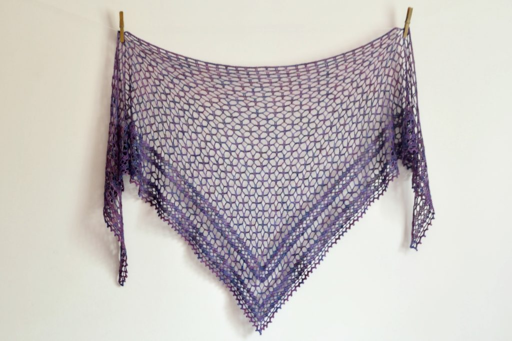 Nightfall Shawl in purple lace lying flat