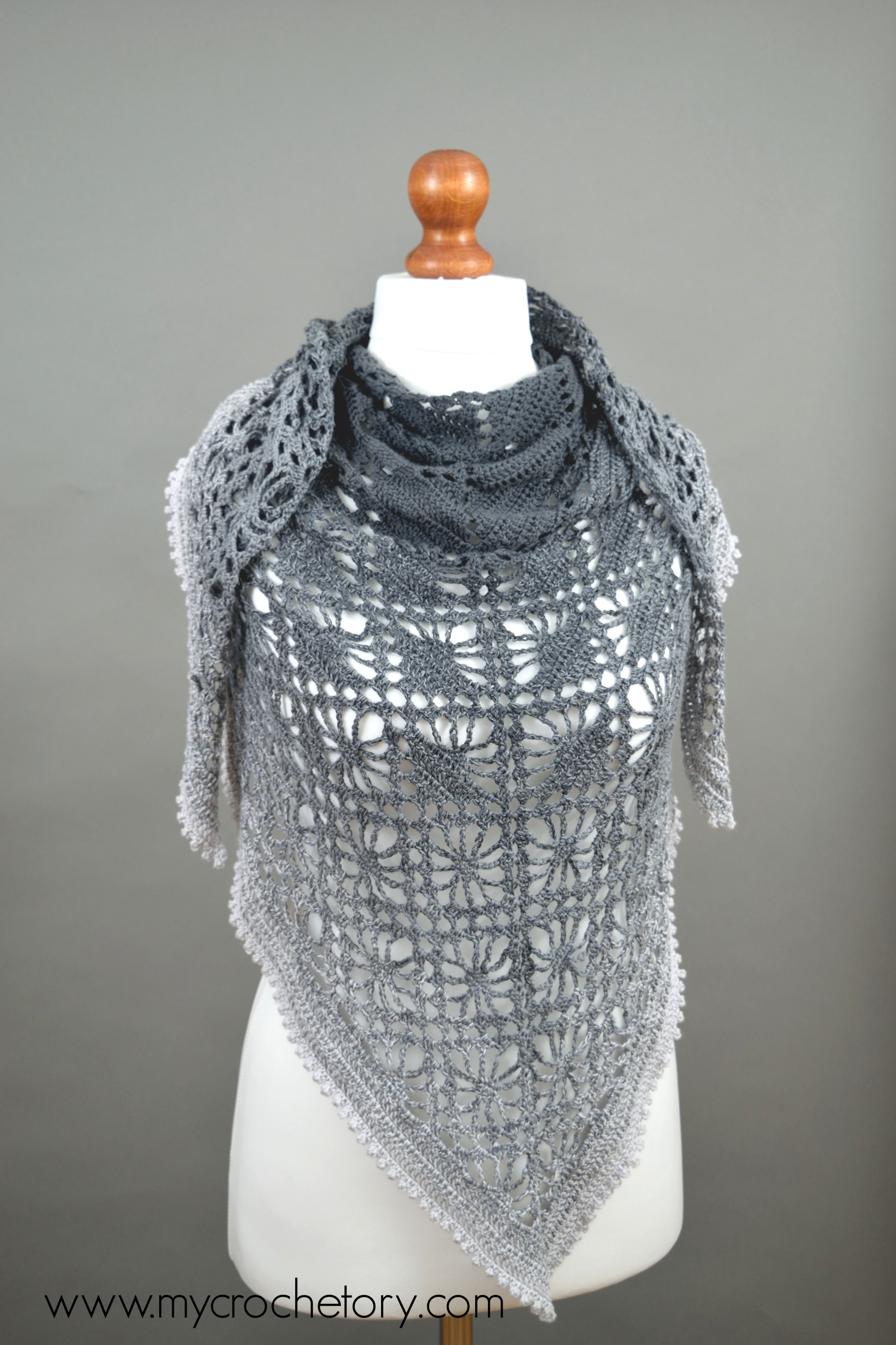 Finished Leto picot edge crochet shawl in a gray gradient on a mannequin