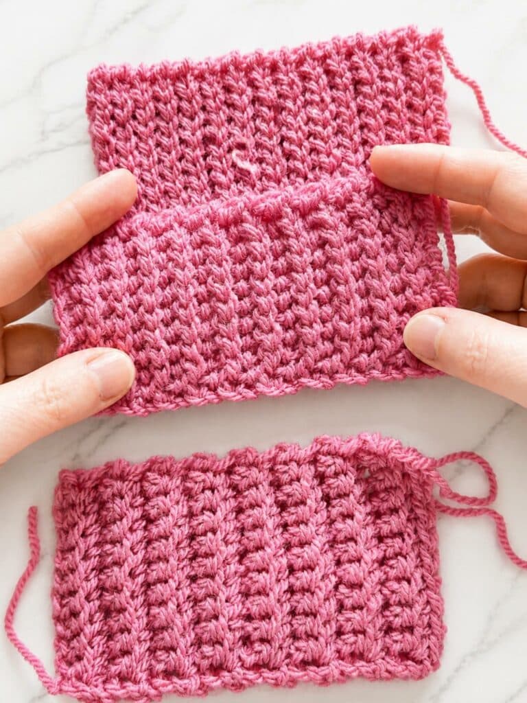 Hands holding a yarn over slip stitch crochet ribbing swatch with soft stretchy knit like texture