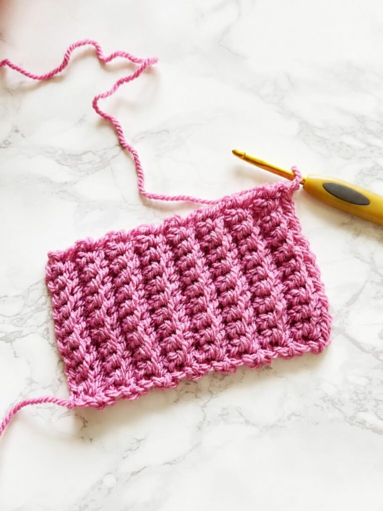 Finished back loop single crochet ribbing swatch with vertical stretchy crochet texture for cuffs and brims