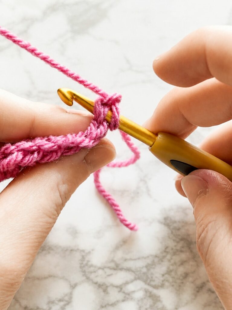 Starting first slip stitch worked under both loops in yarn over slip stitch crochet ribbing tutorial