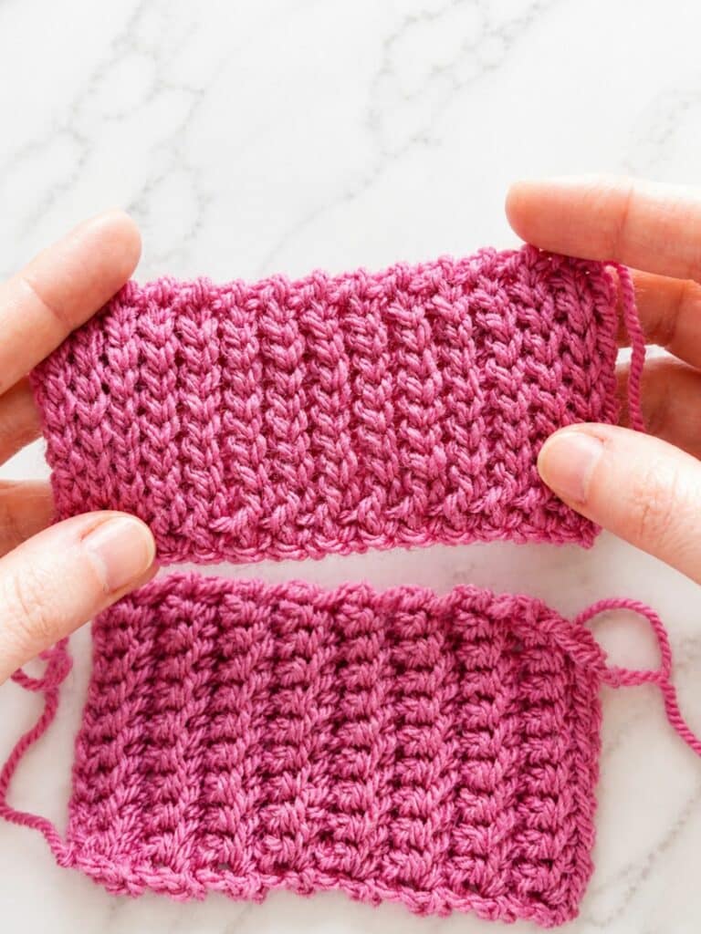 Hands holding a slip stitch crochet ribbing swatch with dense knit look texture for crochet cuffs and brims