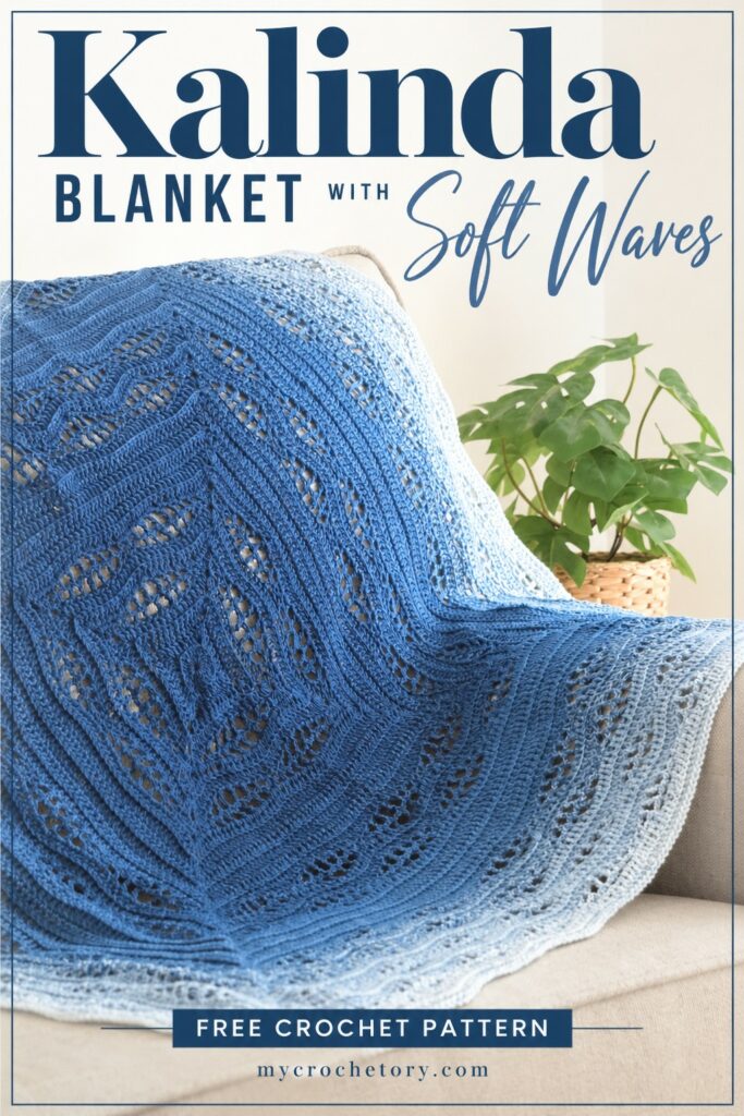 Kalinda Blanket with soft waves, a free center out crochet blanket pattern in blue ombre draped over a sofa