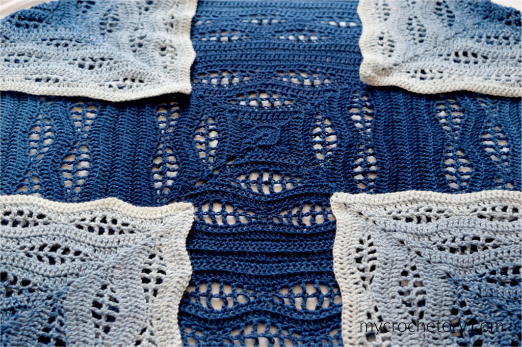 How to crochet a blanket: a beautiful Kalinda Blanket showcasing vibrant waves of color.