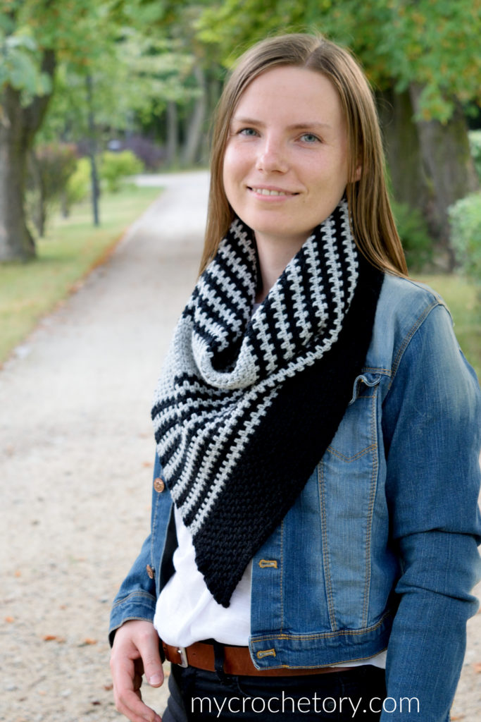 A person wearing the Free Greus Crochet Cowl Pattern in an outdoor setting, demonstrating its functionality and warmth.
