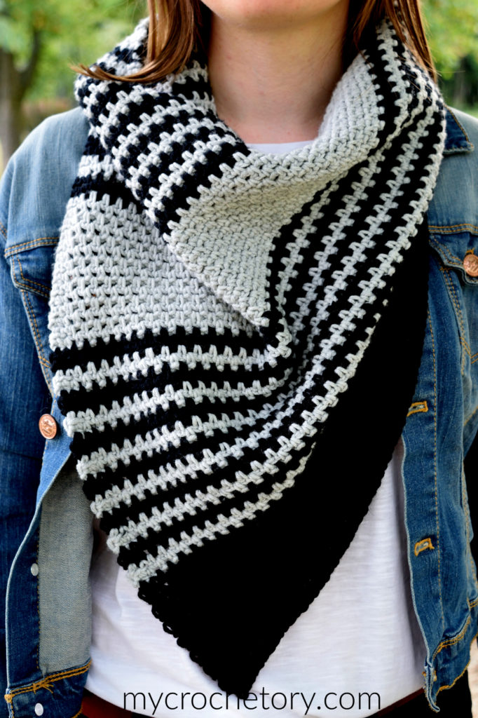 A person wearing the Free Greus Crochet Cowl Pattern in an outdoor setting, demonstrating its functionality and warmth.