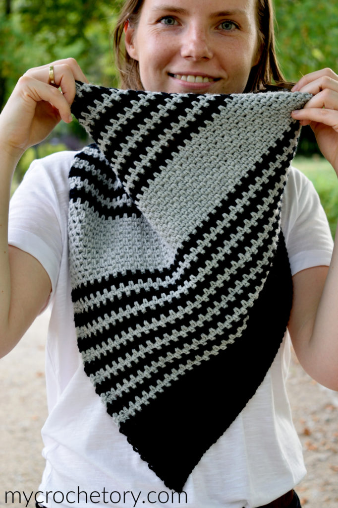 A person wearing the Free Greus Crochet Cowl Pattern in an outdoor setting, demonstrating its functionality and warmth.