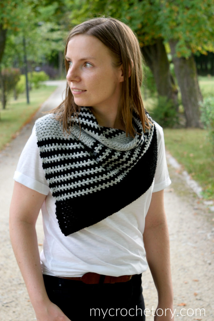 A person wearing the Free Greus Crochet Cowl Pattern in an outdoor setting, demonstrating its functionality and warmth.