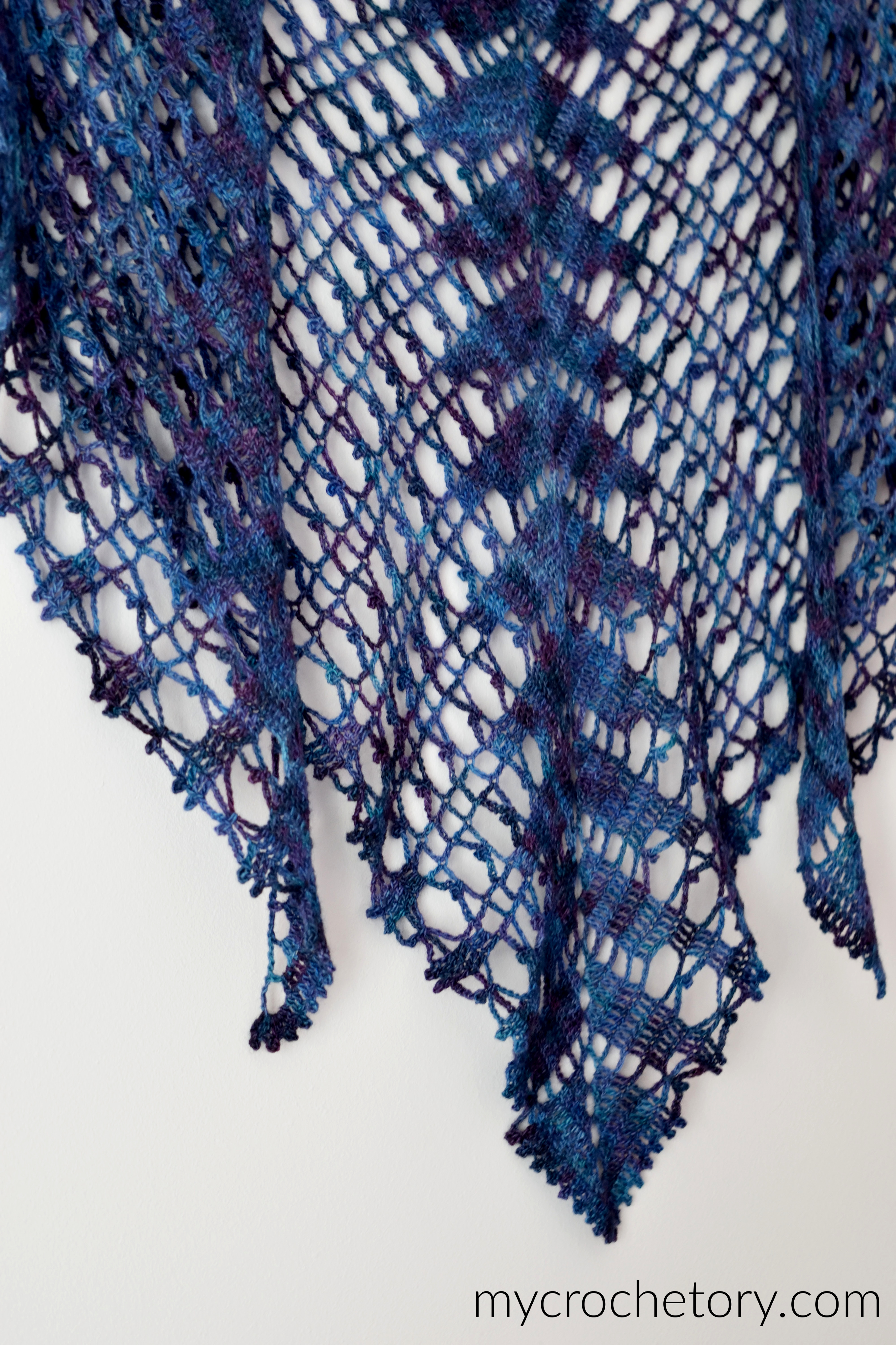 Lace Shawlette worn around the neck with the point at the front over a white T-shirt