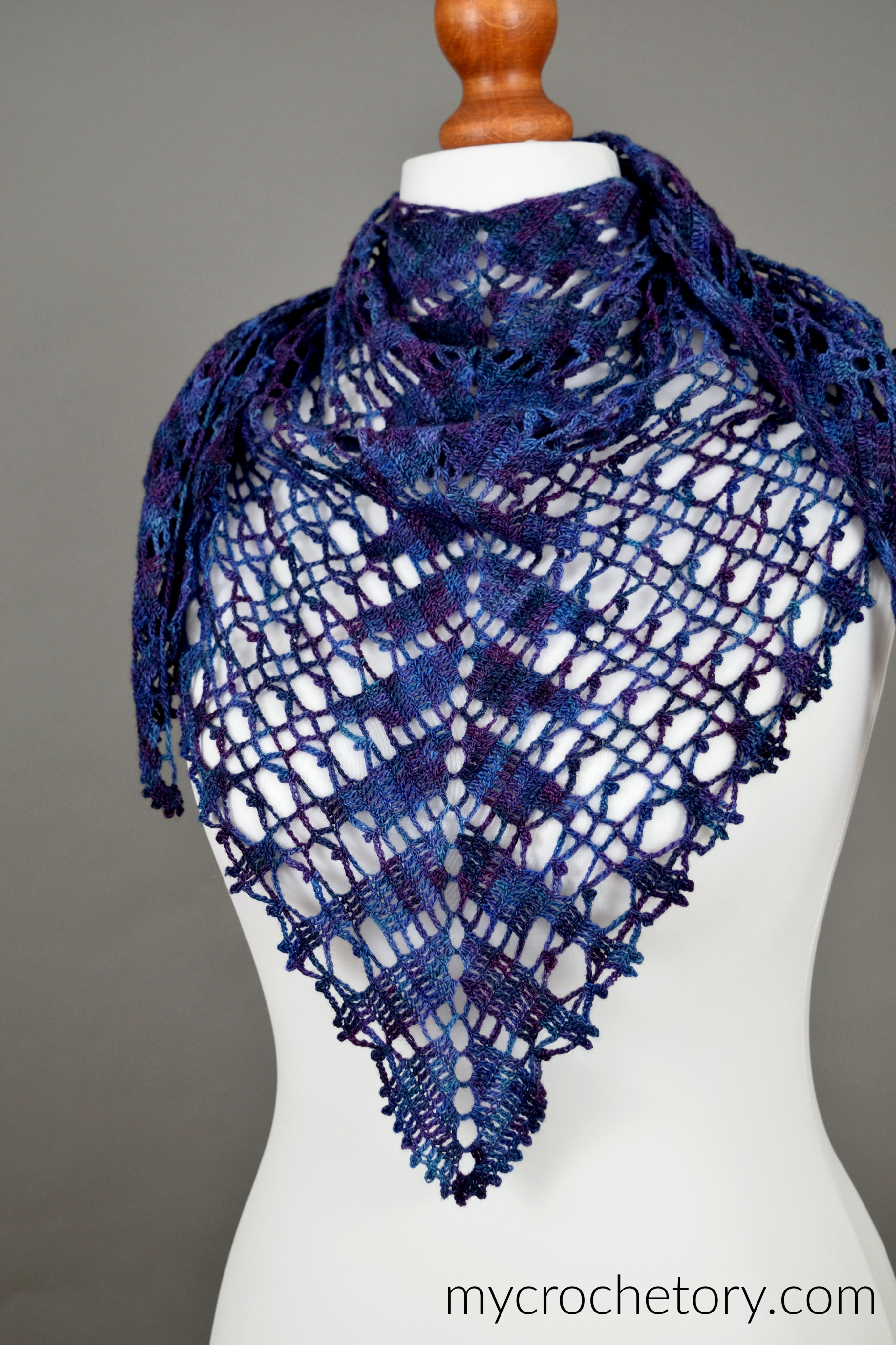 Lace Shawlette spread out on a hanger after wet blocking