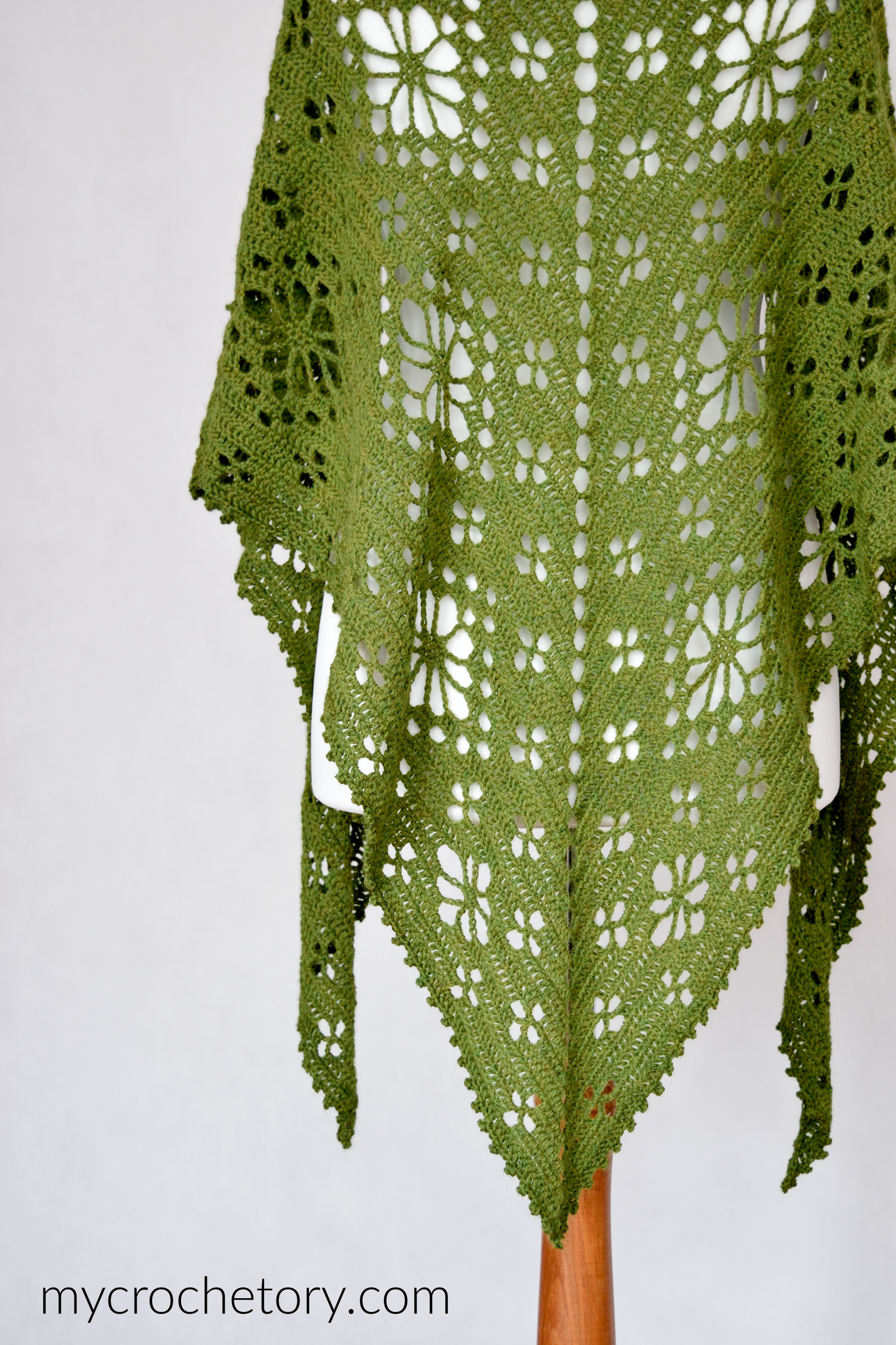 Field of Flowers Shawl from the back, with lines of lace flowers down to the point