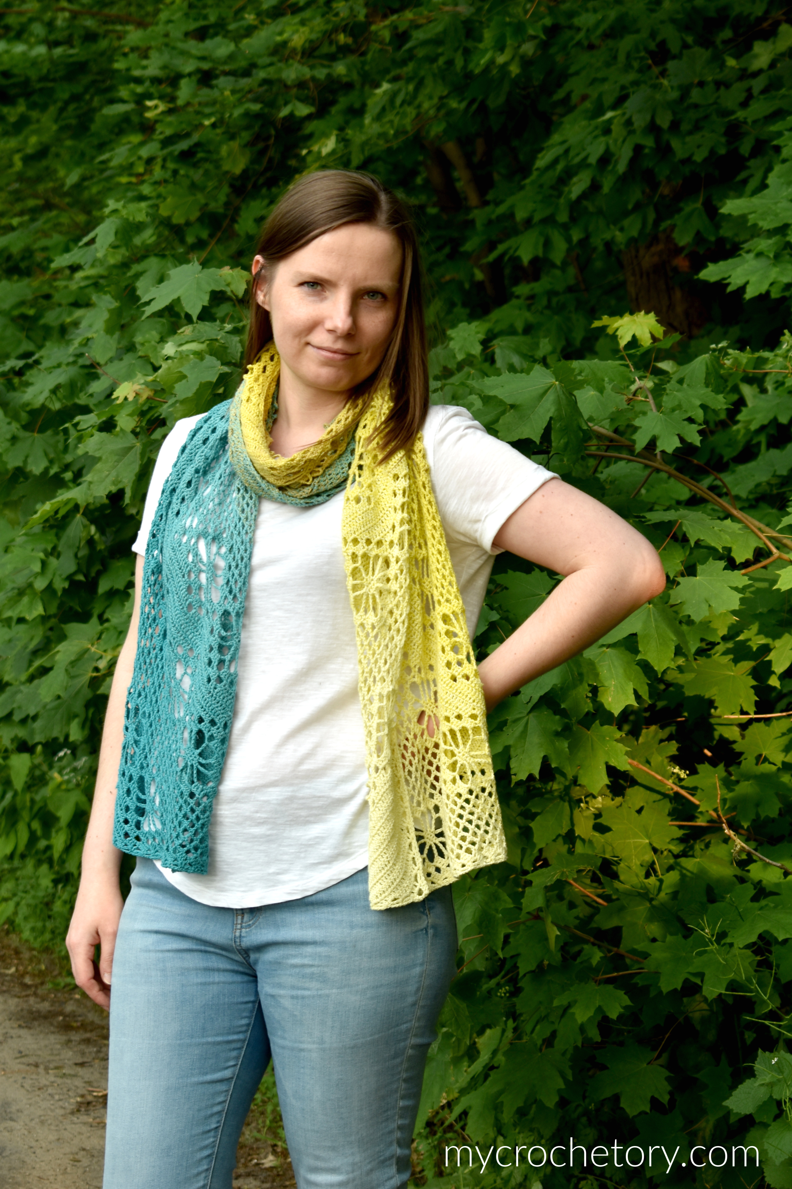 Yellow and teal Zarina crochet scarf worn loose around the neck