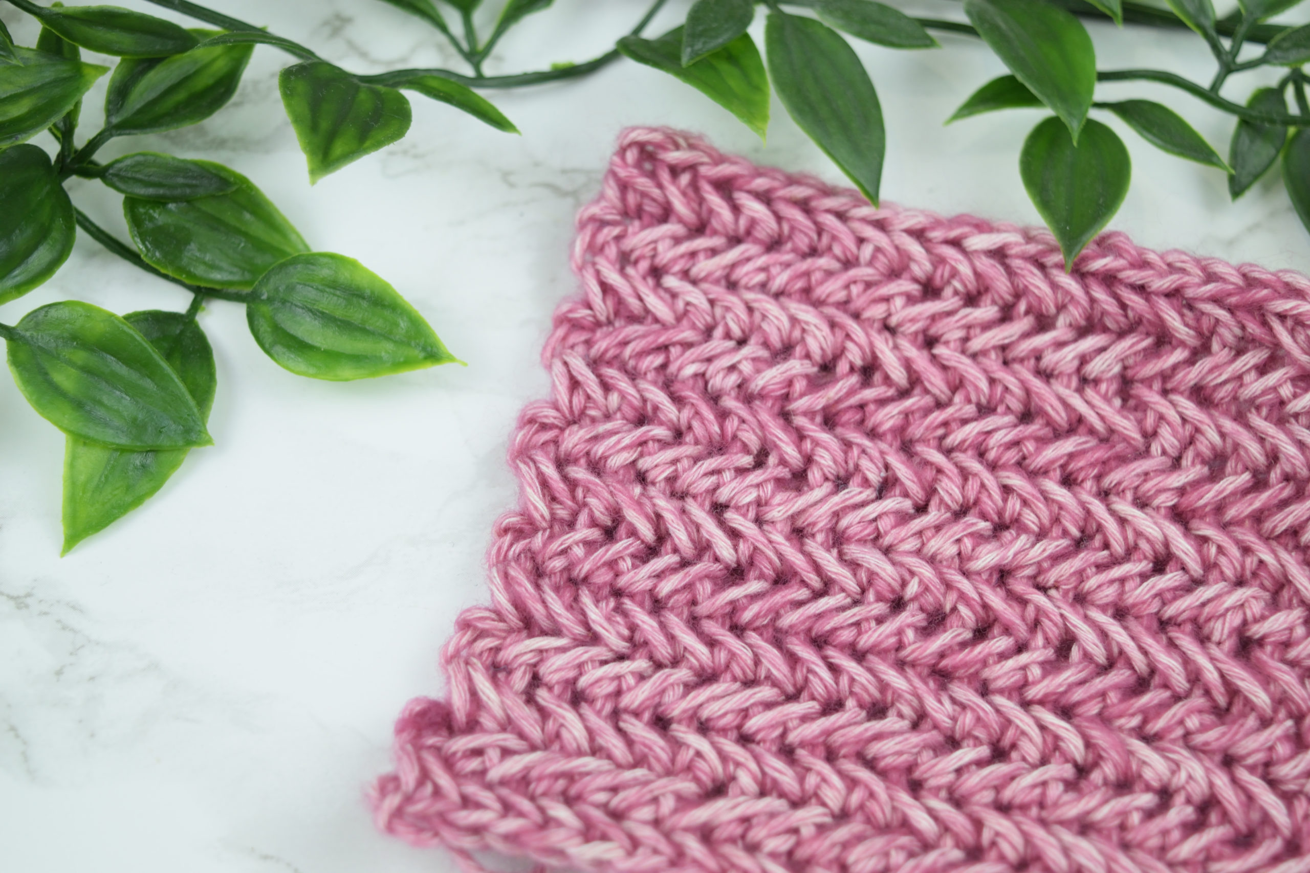 Pink herringbone crochet stitch swatch