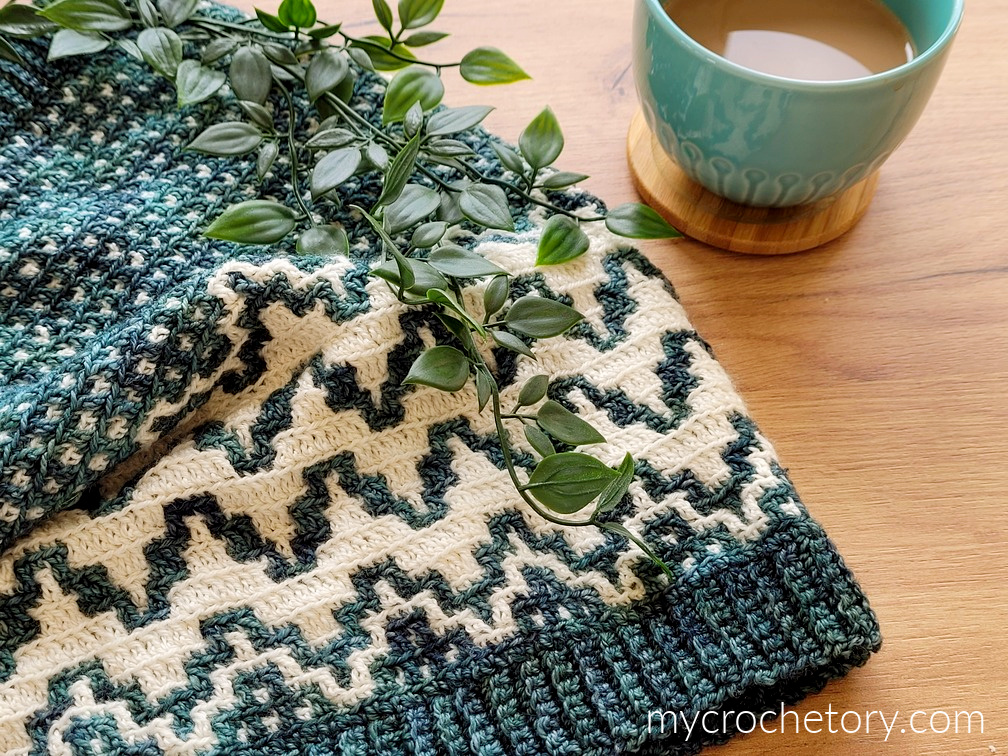 Close-up of the Namari Mosaic Crochet Cowl Pattern Free, showcasing its vibrant colors and intricate texture