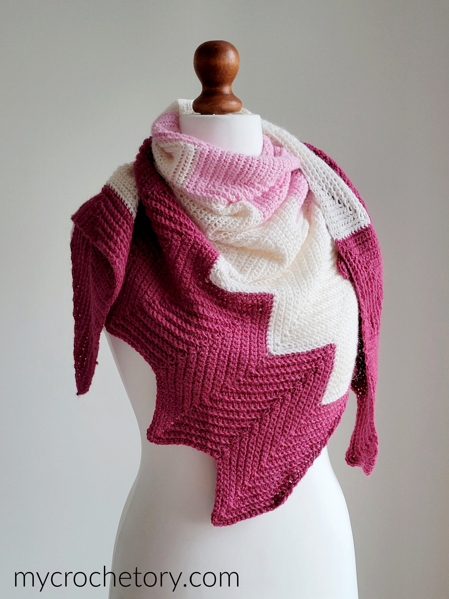 Chevron shawl worn on a mannequin, wrapped around the neck like a scarf