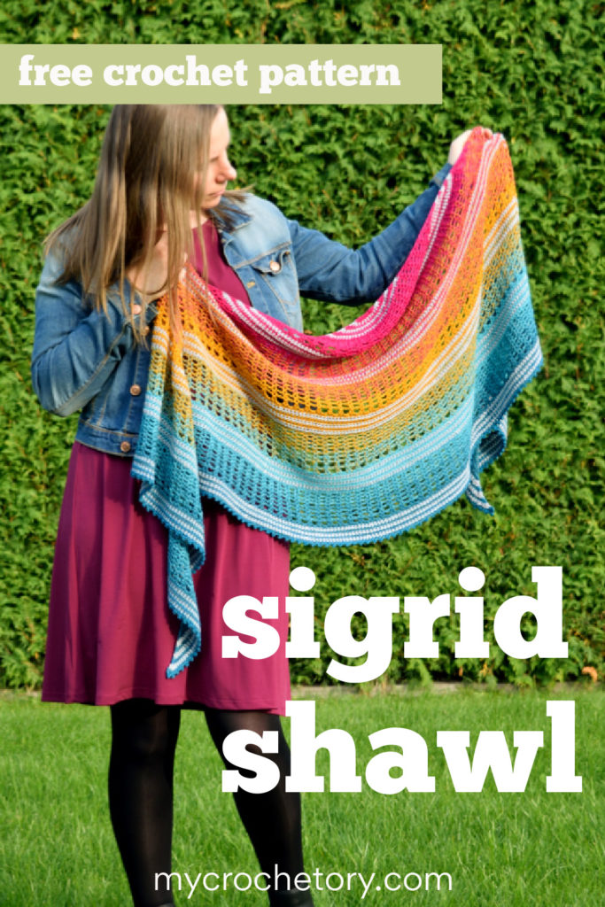 Finished Sigrid lace crescent crochet shawl pattern with gradient yarn.
