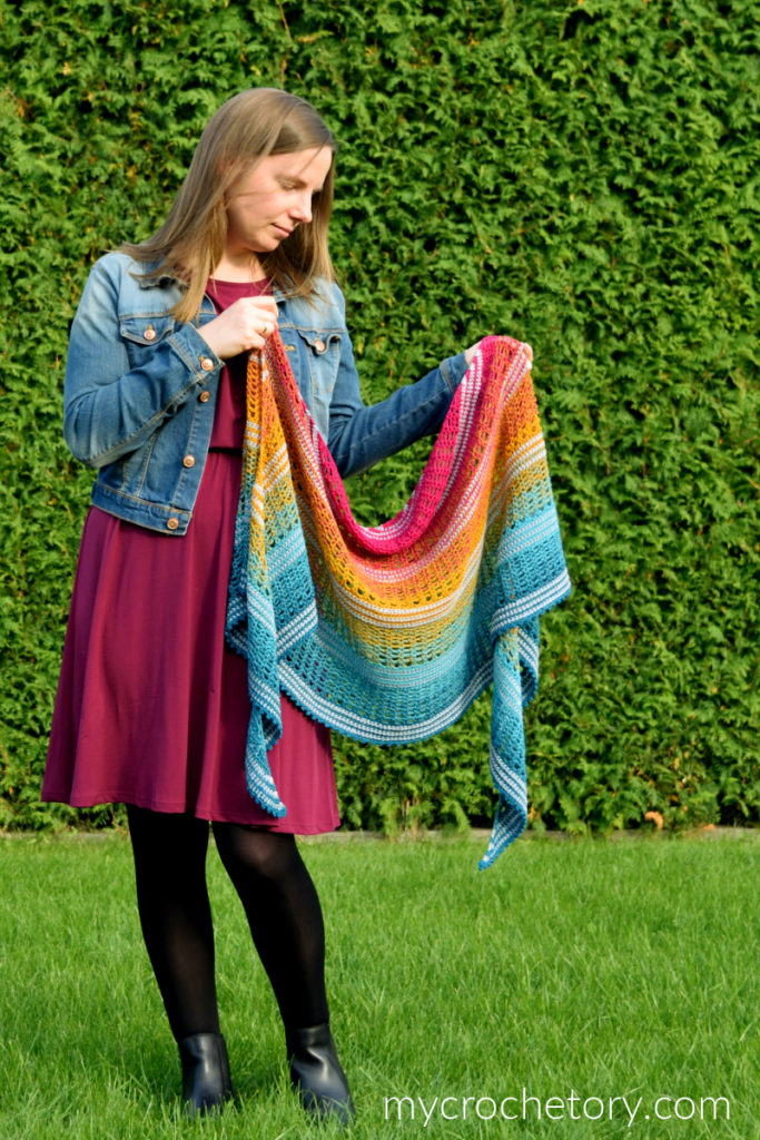 Finished Sigrid lace crescent crochet shawl pattern with gradient yarn.