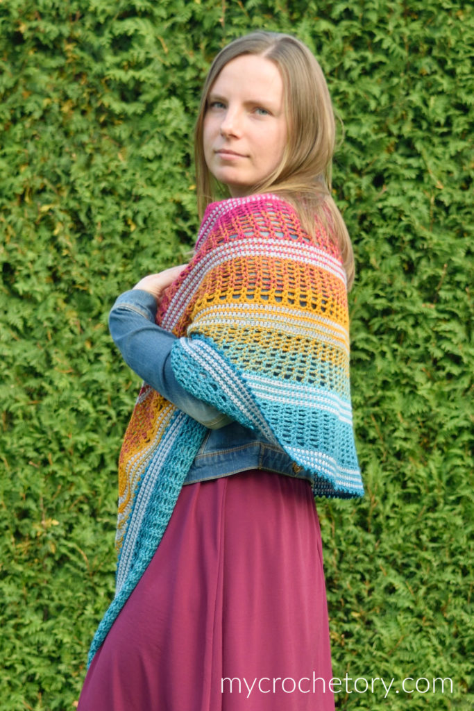 Finished Sigrid lace crescent crochet shawl pattern with gradient yarn.