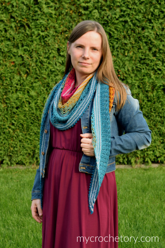 Finished Sigrid lace crescent crochet shawl pattern with gradient yarn.