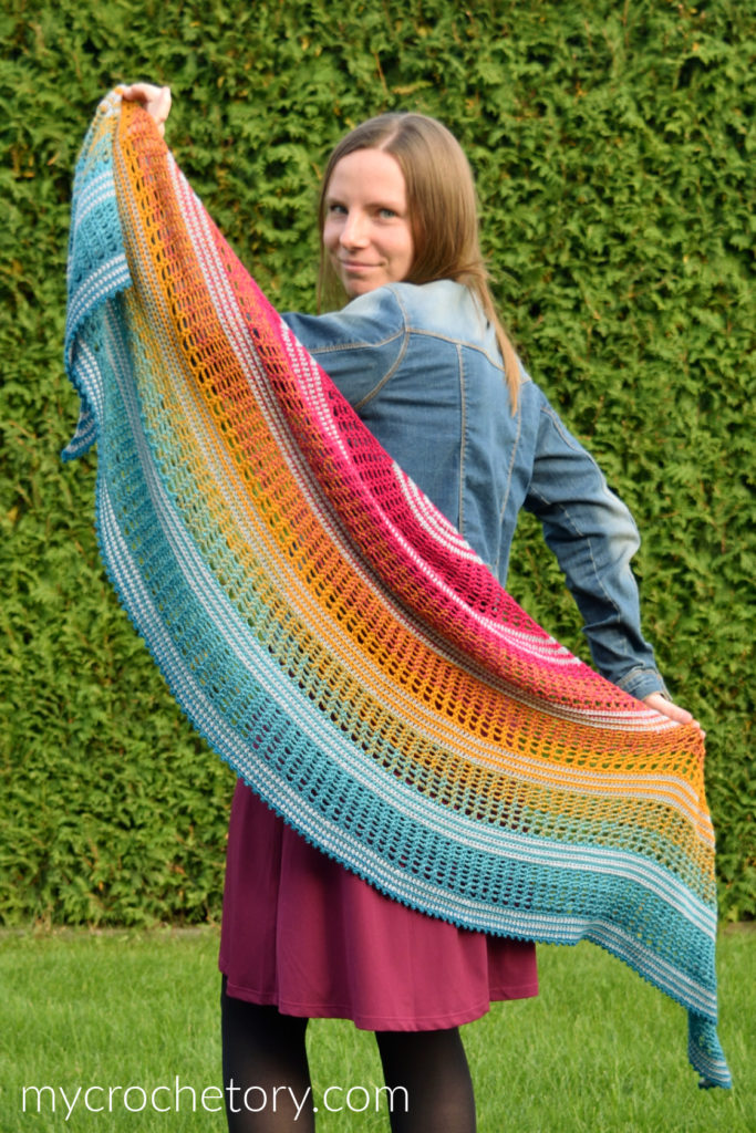 Finished Sigrid lace crescent crochet shawl pattern with gradient yarn.