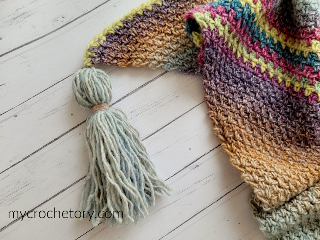 Colorful and oversized Bandos Crochet Shawl pattern free showcasing beautiful striping pattern.