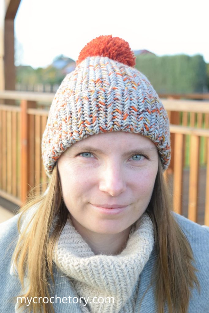Crochet winter hat pattern styled with a cozy scarf