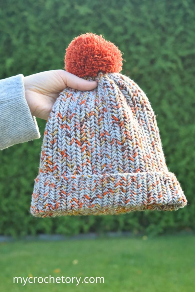Finished crochet winter hat pattern with pom pom