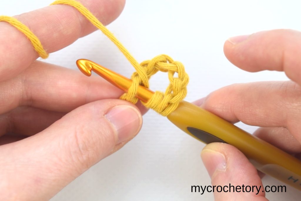 How to treble crochet: hook inserted in the chain.