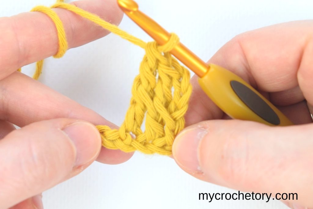 How to double crochet 2 rows at once: two stitches completed.