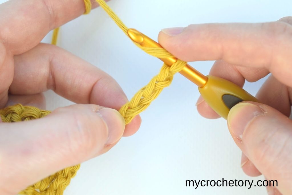 How to double crochet 2 rows at once: showing where to insert the hook.