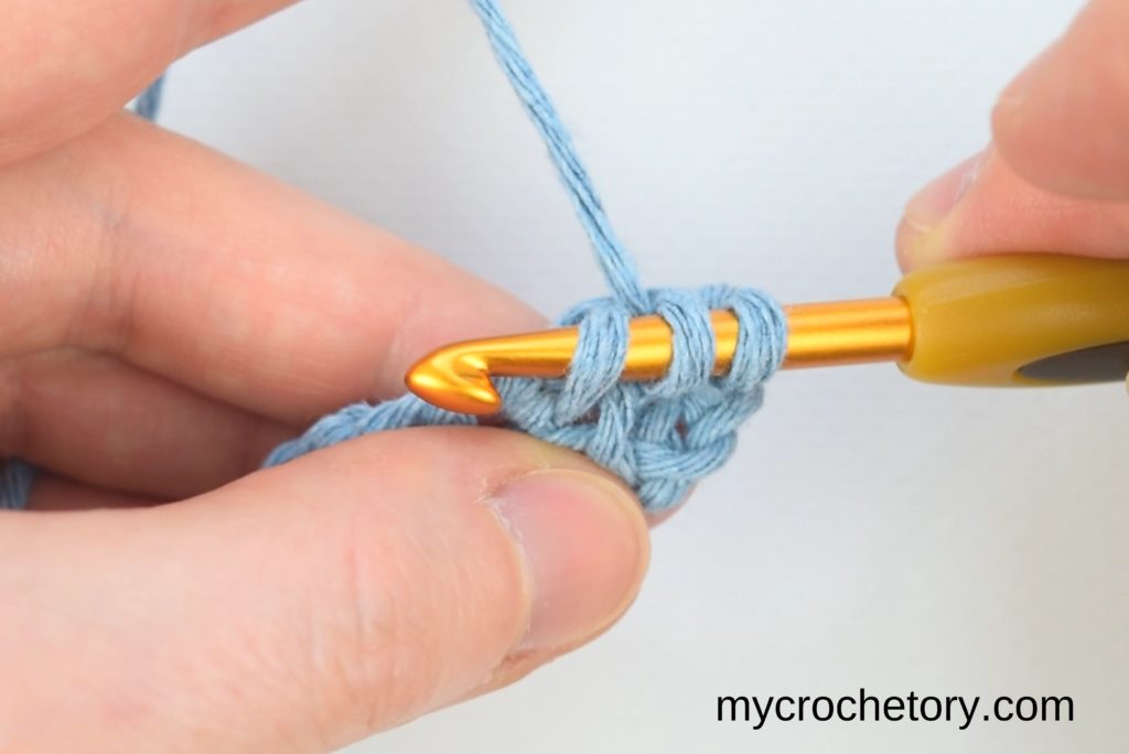 Continuation of the step-by-step process for crocheting two rows at once, emphasizing the yarn-over technique and loop pulling.