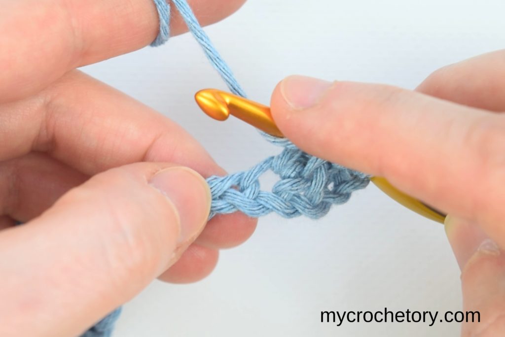 Continuation of the step-by-step process for crocheting two rows at once, emphasizing the yarn-over technique and loop pulling.