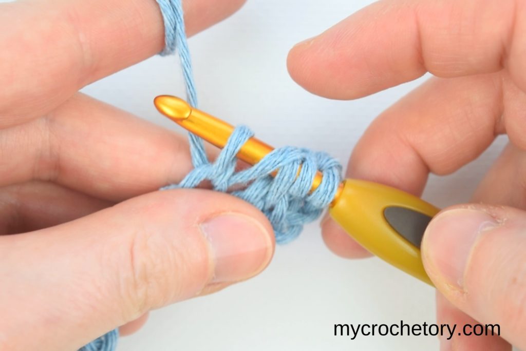Continuation of the step-by-step process for crocheting two rows at once, emphasizing the yarn-over technique and loop pulling.