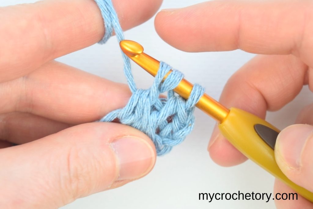Continuation of the step-by-step process for crocheting two rows at once, emphasizing the yarn-over technique and loop pulling.