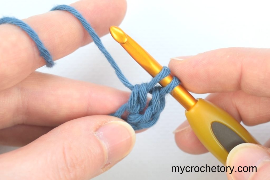 How to double crochet for beginners: two loops on the hook.
