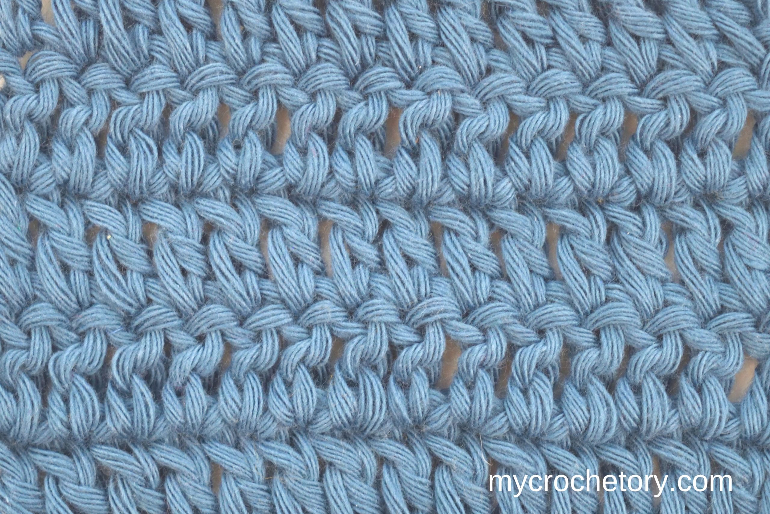 Rows of double crochet in light blue yarn, a basic stitch for beginners