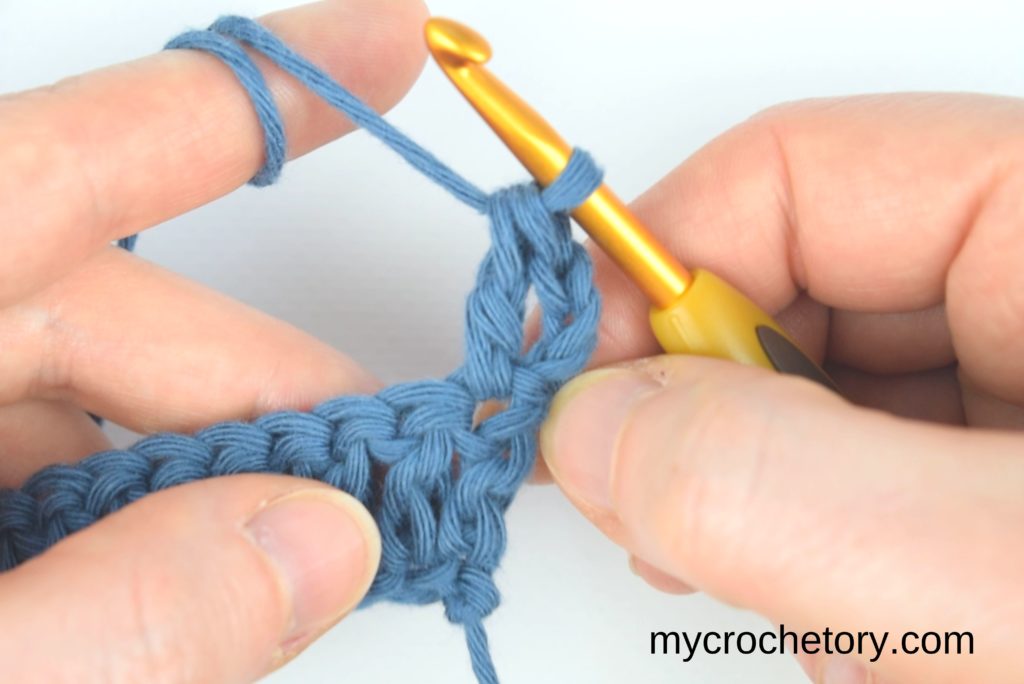 How to double crochet for beginners: furst double crochet of the next row.