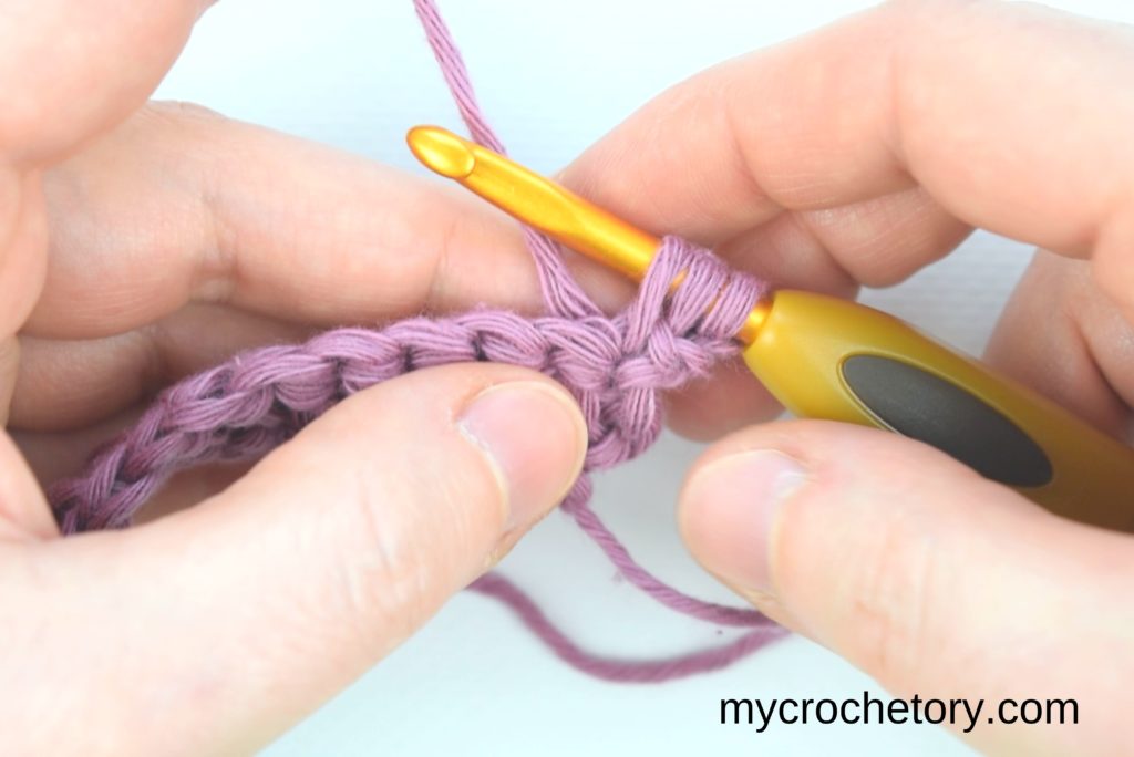 How to Single Crochet 2 Rows at once: inserting the hook into the chain and next stitch.