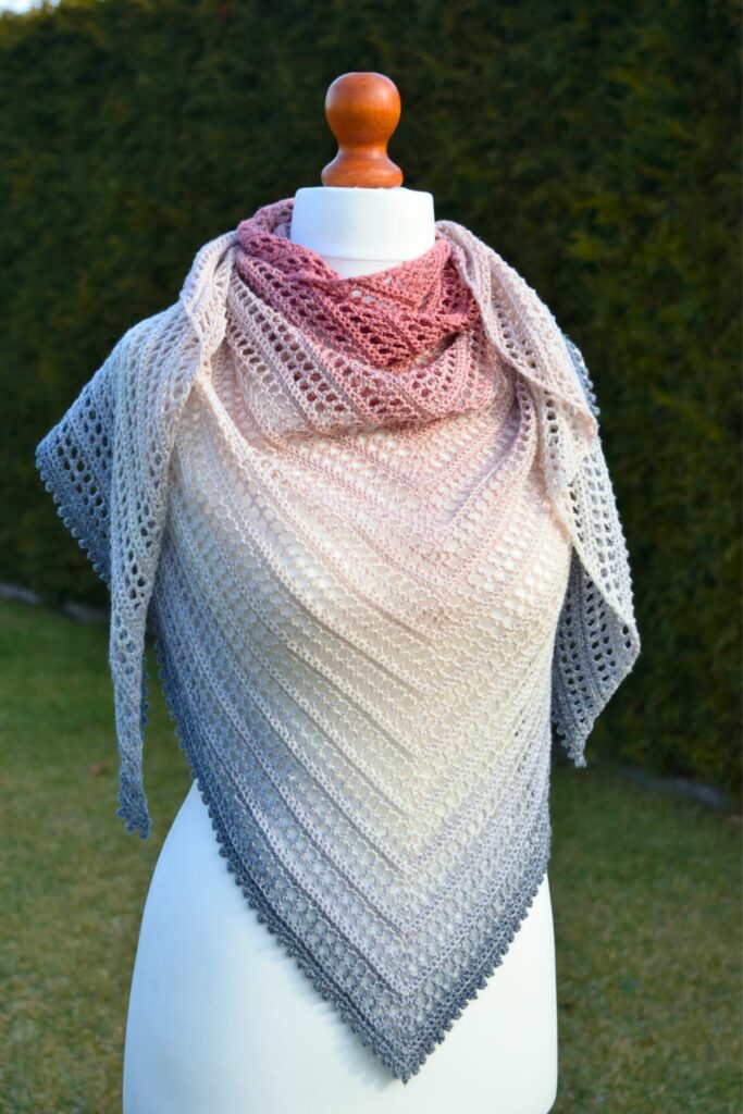 Aprilace Free Crochet Shawl displayed elegantly on a mannequin.