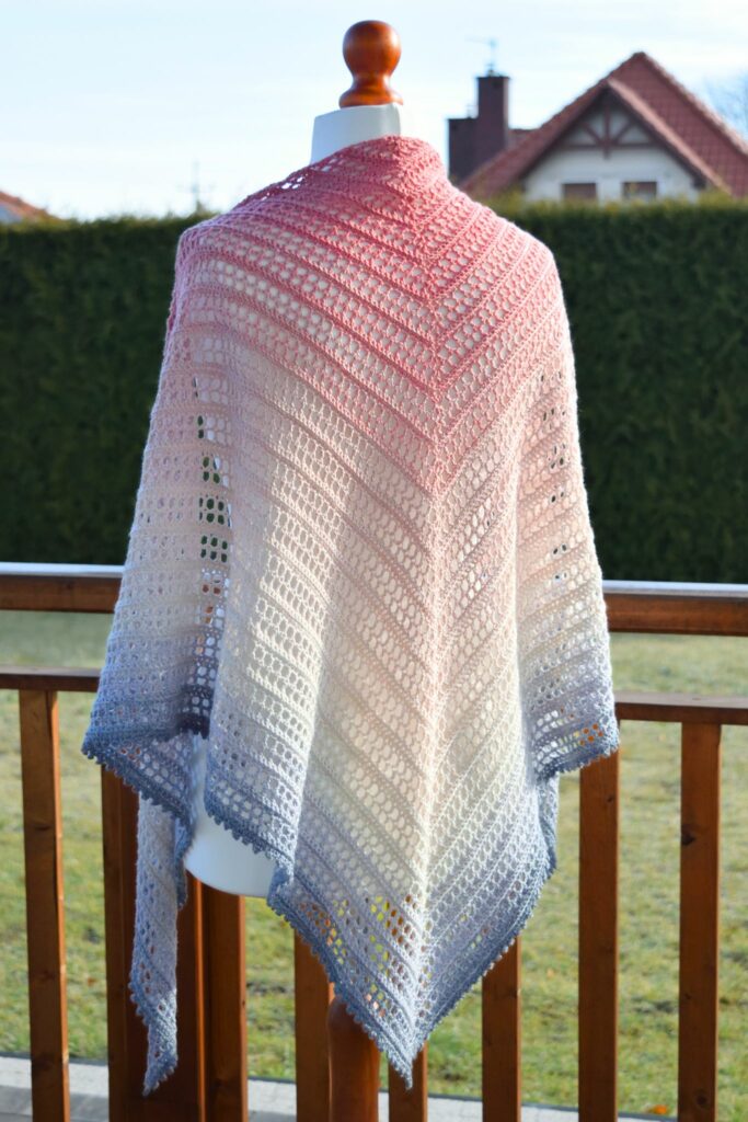 Stunning Aprilace Free Crochet Shawl showcased on a mannequin.